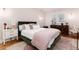 Comfortable bedroom with a stylish velvet bed, soft bedding, and natural light for a serene retreat at 3044 W 37Th Ave, Denver, CO 80211