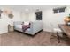 Charming bedroom with modern decor, cozy bed, and functional study area with natural light at 3044 W 37Th Ave, Denver, CO 80211