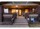 Welcoming front porch featuring brick columns, cozy ambiance, and inviting entrance to the home at 3044 W 37Th Ave, Denver, CO 80211