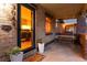 Charming front porch with swing, brick accents, and a view into the dining room through the front door at 3044 W 37Th Ave, Denver, CO 80211