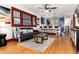Bright and airy living area with hardwood floors, comfortable seating, and open flow to the kitchen at 3044 W 37Th Ave, Denver, CO 80211