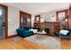 Cozy living room with natural light, a fireplace, and a comfortable seating area at 3044 W 37Th Ave, Denver, CO 80211
