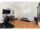 Home gym featuring hardwood floors and a variety of workout equipment at 3044 W 37Th Ave, Denver, CO 80211