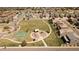 Expansive aerial view showcasing the community playground, basketball court, and surrounding neighborhood at 12563 Grape St, Thornton, CO 80241