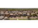 Wide aerial shot of a densely populated neighborhood with well-maintained homes and tree-lined streets at 12563 Grape St, Thornton, CO 80241