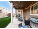 Backyard patio featuring string lights, outdoor furniture, a fire pit, and a barbecue grill at 12563 Grape St, Thornton, CO 80241