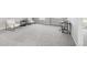 Spacious carpeted bonus room with natural light, offering versatile use at 12563 Grape St, Thornton, CO 80241