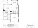 First floor plan showing the layout of the living room, kitchen, dining room, and garage at 12563 Grape St, Thornton, CO 80241