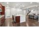 Open-concept kitchen features large island with seating and stainless steel appliances at 12563 Grape St, Thornton, CO 80241