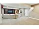 Finished basement with carpeted floors, built-in bookshelves, seating area, and stairs at 3534 Starry Night Loop, Castle Rock, CO 80109