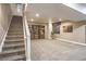 Finished basement with carpeted floors, built-in bookshelves, and stairs to upper level at 3534 Starry Night Loop, Castle Rock, CO 80109