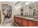 Bathroom with double sinks, granite countertops, decorative backsplash and decorative rug at 3534 Starry Night Loop, Castle Rock, CO 80109
