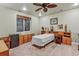 Bedroom features a bed, ceiling fan, bureau, and window with blinds at 3534 Starry Night Loop, Castle Rock, CO 80109