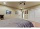 Relaxing bedroom featuring carpet flooring, closet with slider doors, neutral walls with natural light from the hallway at 3534 Starry Night Loop, Castle Rock, CO 80109