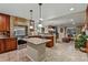 Open kitchen with granite counters, stainless steel appliances, a central island, and tile flooring at 3534 Starry Night Loop, Castle Rock, CO 80109