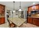 Beautiful kitchen featuring an island, stainless steel appliances, granite counters and tile flooring at 3534 Starry Night Loop, Castle Rock, CO 80109