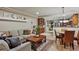 Comfortable living room with sofa, area rug, and built in display shelving at 3534 Starry Night Loop, Castle Rock, CO 80109