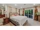 Bright main bedroom featuring decorative windows and a large bed at 3534 Starry Night Loop, Castle Rock, CO 80109