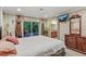 Bright main bedroom featuring decorative windows and a large bed at 3534 Starry Night Loop, Castle Rock, CO 80109