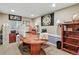 Office with wooden desk, display bookcase, and ample natural light at 3534 Starry Night Loop, Castle Rock, CO 80109