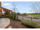 Backyard featuring manicured landscaping, a fence and an outdoor living space overlooking a golf course at 10067 Bluffmont Ct, Lone Tree, CO 80124