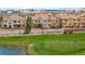Scenic view overlooking the golf course with well-maintained homes and mature trees in the background at 10067 Bluffmont Ct, Lone Tree, CO 80124