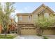 Charming two-story home featuring a stone accent, attached garage, and well-maintained landscaping at 10067 Bluffmont Ct, Lone Tree, CO 80124