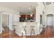 Kitchen featuring granite counters, stainless steel appliances, and hardwood flooring at 10067 Bluffmont Ct, Lone Tree, CO 80124