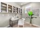 Well-lit office featuring a built-in bookcase and modern desk, perfect for working from home at 10067 Bluffmont Ct, Lone Tree, CO 80124
