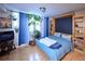 Bedroom featuring a Murphy bed, bright light from a window, and lovely plants to bring nature inside at 1196 N Grant St # 104, Denver, CO 80203