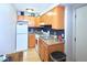 Functional kitchen with classic wood cabinets, ample counter space, and essential appliances for comfortable cooking at 1196 N Grant St # 104, Denver, CO 80203
