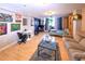 Inviting living area with stylish decor, featuring hardwood floors, comfortable seating, and vibrant wall art at 1196 N Grant St # 104, Denver, CO 80203