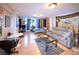 Bright, open living space with hardwood floors, cozy furniture, and ample natural light, perfect for relaxing or entertaining at 1196 N Grant St # 104, Denver, CO 80203