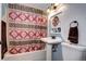 A view of a bathroom with a shower/tub combination and a pedestal sink at 4070 W Exposition Ave, Denver, CO 80219