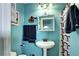 A view of a full bathroom with a pedestal sink, a mirrored medicine cabinet, and modern fixtures at 4070 W Exposition Ave, Denver, CO 80219