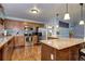 A view of the kitchen with stainless steel appliances, wooden cabinets, and light blue walls at 4070 W Exposition Ave, Denver, CO 80219