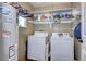 This is a view of the laundry room with a shelf above the washer and dryer at 4070 W Exposition Ave, Denver, CO 80219
