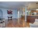 Spacious living room with beautiful hardwood floors that flows into the kitchen and dining area at 4070 W Exposition Ave, Denver, CO 80219