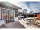 Enjoy outdoor gatherings on the concrete patio with seating and views of the backyard at 4070 W Exposition Ave, Denver, CO 80219