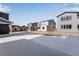 View of home exteriors with snow-covered backyards in a new residential development at 13531 E 99Th Pl, Commerce City, CO 80022