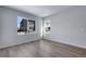 Comfortable bedroom with hardwood floors, natural light, and neutral interior at 13531 E 99Th Pl, Commerce City, CO 80022