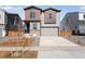 Modern two-story home with a driveway, lawn and attractive curb appeal at 13531 E 99Th Pl, Commerce City, CO 80022