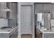 Kitchen featuring gas range, stainless appliances, granite countertops, and ample storage at 13531 E 99Th Pl, Commerce City, CO 80022