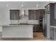Modern kitchen features stainless steel appliances, granite countertops, and a large island at 13531 E 99Th Pl, Commerce City, CO 80022