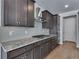 Well-appointed kitchen featuring stainless steel appliances, granite countertops, and subway tile backsplash at 13531 E 99Th Pl, Commerce City, CO 80022