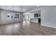 Bright living room with hardwood floors, recessed lighting, and an open floor plan with kitchen at 13531 E 99Th Pl, Commerce City, CO 80022