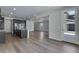 Living room adjacent to the kitchen with an open floor plan and exterior door to backyard at 13531 E 99Th Pl, Commerce City, CO 80022