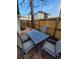 Backyard patio featuring a dining table with seating on a brick paver area at 914 E Iowa Ave, Denver, CO 80210