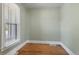 Cozy bedroom with classic hardwood floors and natural lighting from the window at 914 E Iowa Ave, Denver, CO 80210