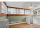 Bright bedroom with a ceiling fan and unique panel windows at 914 E Iowa Ave, Denver, CO 80210